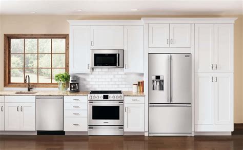 cream cabinets with stainless steel appliances|cream cabinets vs white.